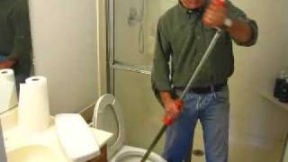 How to Clear a Toilet Clog using a Closet Auger [upl. by Rafaelia8]