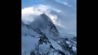 Clouds Drift Over the SnowCapped Mountain Peak [upl. by Susy]