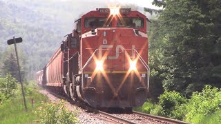 SD70M2 8012 Leads a Big Manifest Train CN 306 wDPU across the Quebec  NB Border at Boundary NB [upl. by Hatty600]