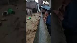 Dramatic moment CAR swept away in seconds during flash flood in China [upl. by Nysila539]