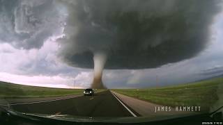 Storm chasing dashcam Tornado crossing the highway Laramie Wyoming [upl. by Monteria]