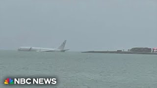 US military aircraft overshoots runway and lands in Hawaii bay [upl. by Glassman594]