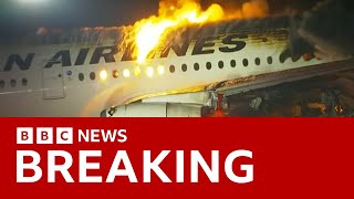 Japan Airlines plane in flames on the runway at Tokyos Haneda Airport BBC News [upl. by Lepper]