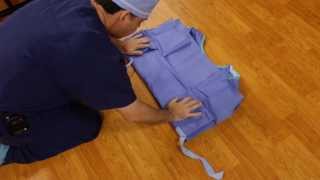 How to fold a surgical gown  Kirkwood Community College Surgical Technology [upl. by Akkeber]