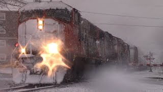 Say it aint Snow Long Manifest Train CN 507 Rolling thru Moncton NB During Spring Snowstorm [upl. by Doti439]