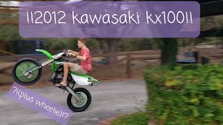 KAWASAKI KX 100 REVIEW PLUS WHEELIE [upl. by Legir530]