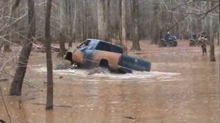 Huge mud trucks in deep slough [upl. by Oilenroc]