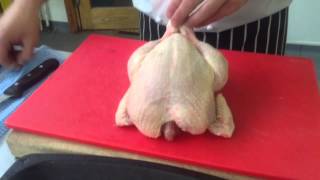 How To Trussa Chicken For Roasting Using A Trussing Needle [upl. by Mclain]